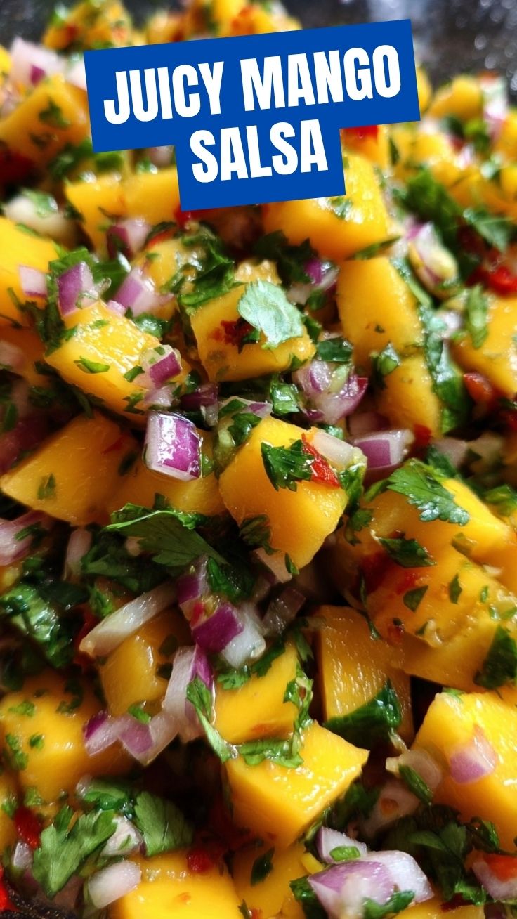 Bowl of fresh mango salsa with diced red onion, cilantro, and lime